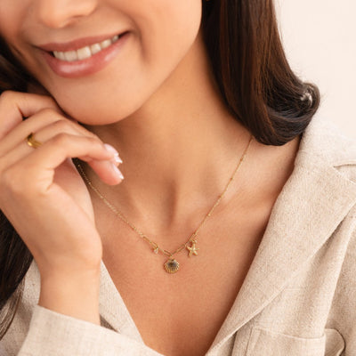 Collana con conchiglia dorata e stella marina