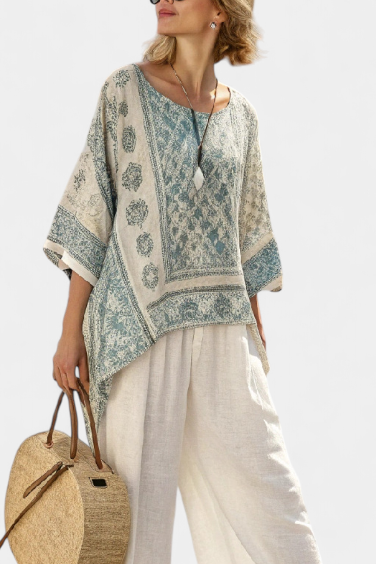 Completo Boho Daisy con Blusa Stampata e Pantaloni Ampi Bianchi per uno Stile Casual e Moderno