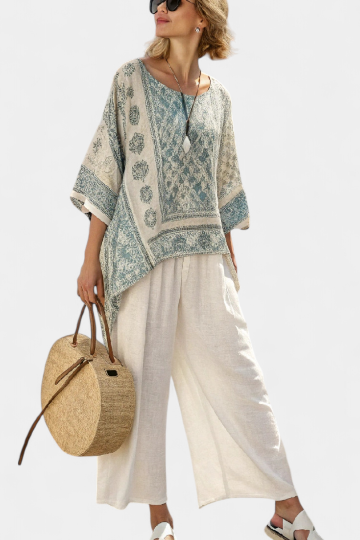 Completo Boho Daisy con Blusa Stampata e Pantaloni Ampi Bianchi per uno Stile Casual e Moderno